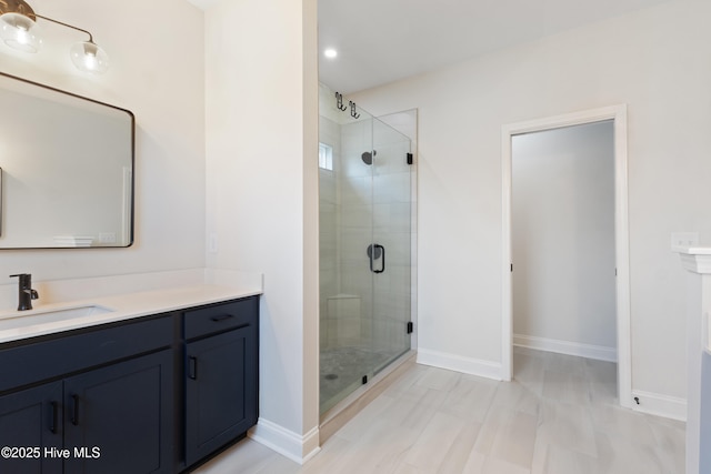 bathroom with vanity and walk in shower