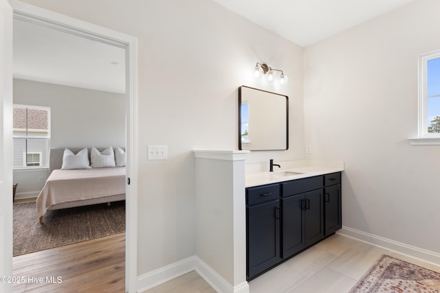 bathroom featuring vanity and wood-type flooring