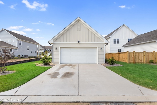 view of front of home with a garage, central air condition unit, and a front lawn