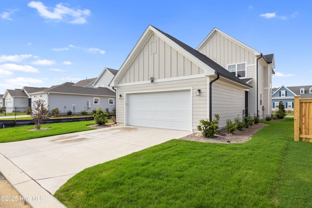 view of front of property featuring a garage and a front yard