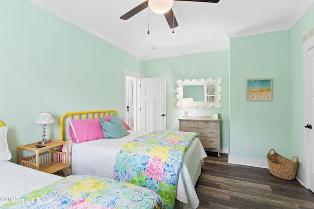 bedroom with crown molding, dark wood-type flooring, and ceiling fan