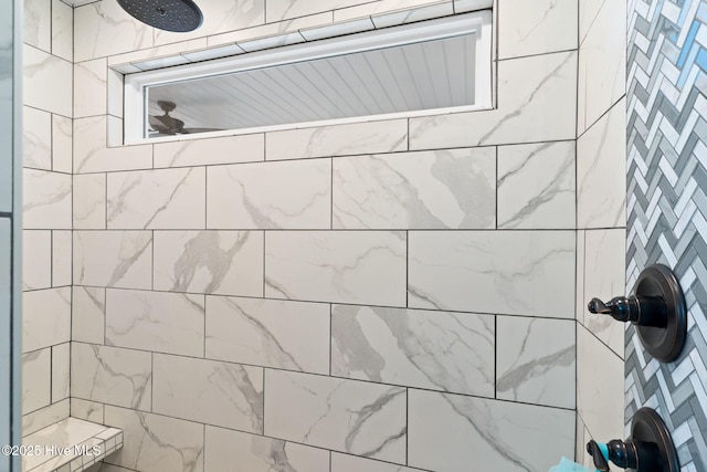 bathroom with a tile shower