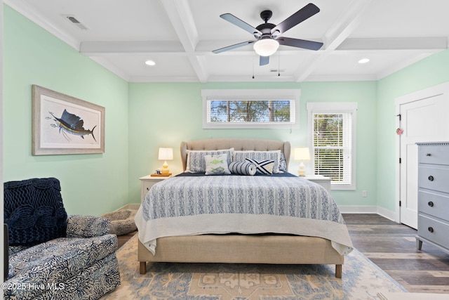 bedroom with coffered ceiling, hardwood / wood-style flooring, and beam ceiling