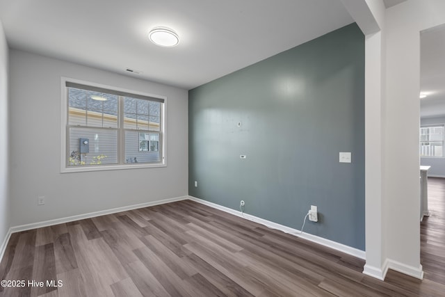 spare room with hardwood / wood-style flooring