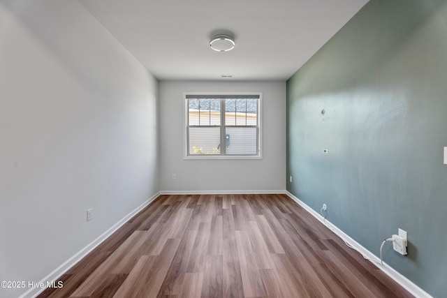 spare room with light wood-type flooring