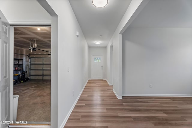 hallway with wood-type flooring