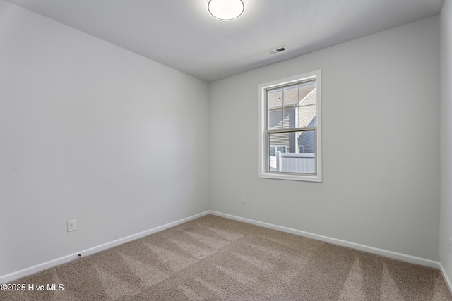 empty room featuring carpet floors