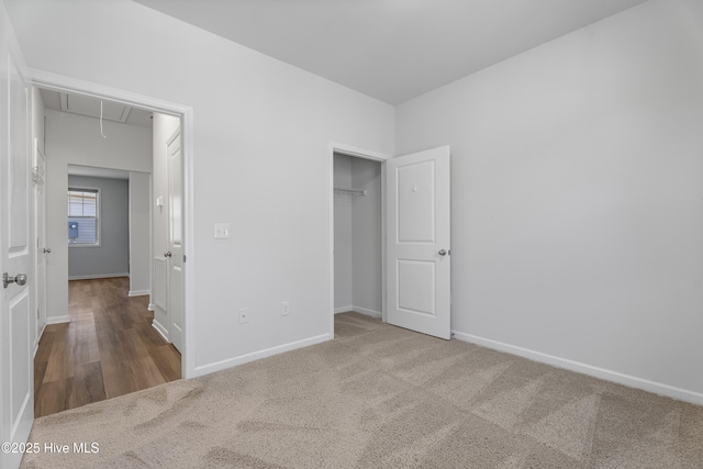 unfurnished bedroom featuring carpet floors and a closet