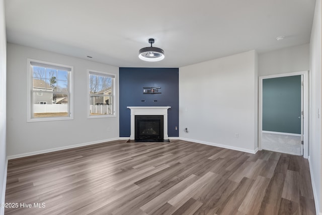 unfurnished living room with hardwood / wood-style floors