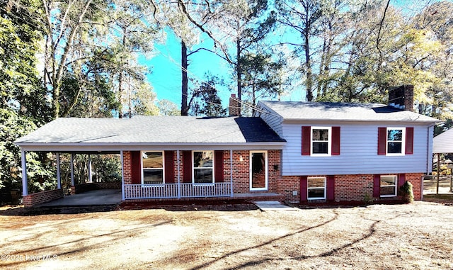 split level home with covered porch