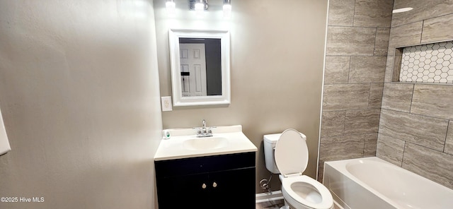 full bathroom featuring tiled shower / bath combo, vanity, and toilet