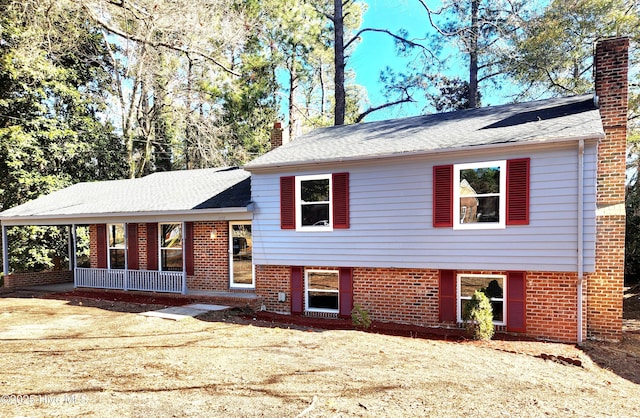 split level home featuring covered porch