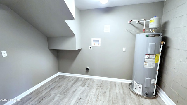 interior space with washer hookup, light hardwood / wood-style flooring, water heater, and electric dryer hookup