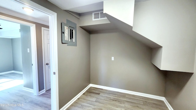 corridor featuring crown molding and light wood-type flooring