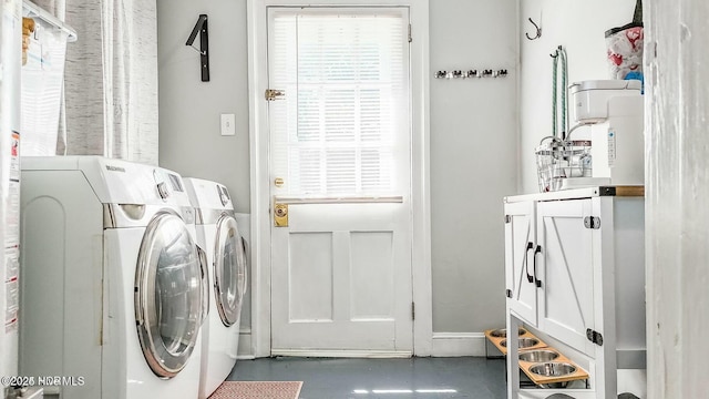 laundry area featuring washing machine and clothes dryer