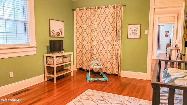 bedroom featuring hardwood / wood-style flooring