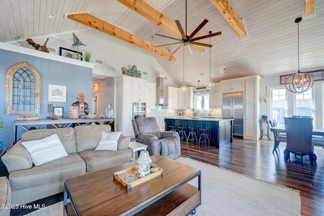 living room with beamed ceiling, ceiling fan with notable chandelier, wooden ceiling, and dark hardwood / wood-style flooring