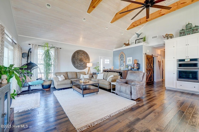 living room featuring wood ceiling, ceiling fan, dark hardwood / wood-style floors, a barn door, and beamed ceiling