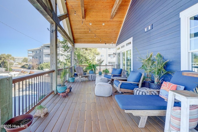 wooden terrace featuring outdoor lounge area