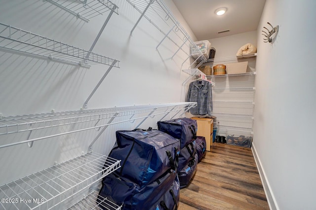 walk in closet featuring wood-type flooring