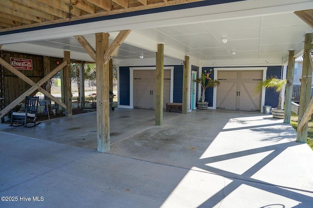 view of patio / terrace featuring a garage