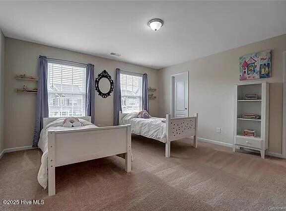 laundry room with baseboards, laundry area, tile patterned flooring, and washer and dryer