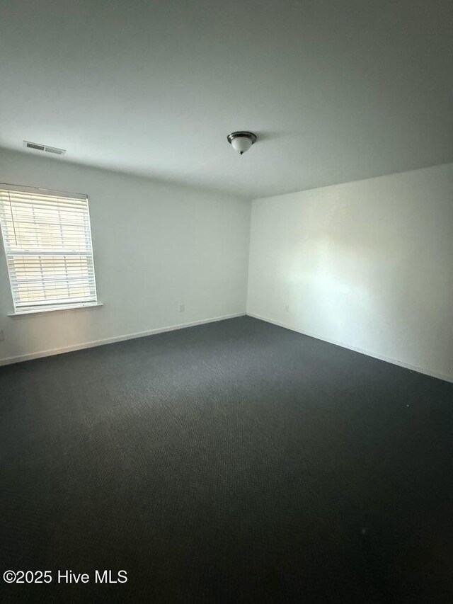 carpeted bedroom featuring baseboards