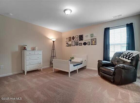 unfurnished bedroom featuring carpet and baseboards