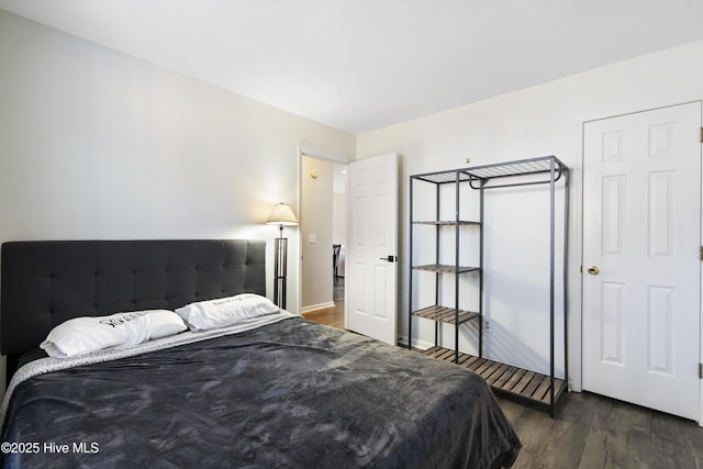 bedroom featuring dark hardwood / wood-style floors