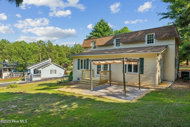 back of house featuring a yard and a patio