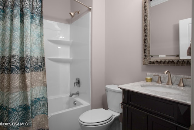 bathroom featuring vanity, shower / bath combination with curtain, and toilet