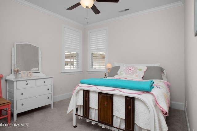 bedroom with carpet flooring, baseboards, a ceiling fan, and crown molding