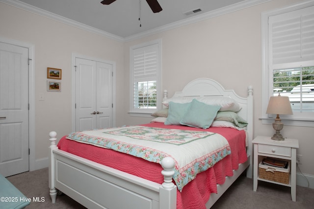 carpeted bedroom with multiple windows, visible vents, and ornamental molding