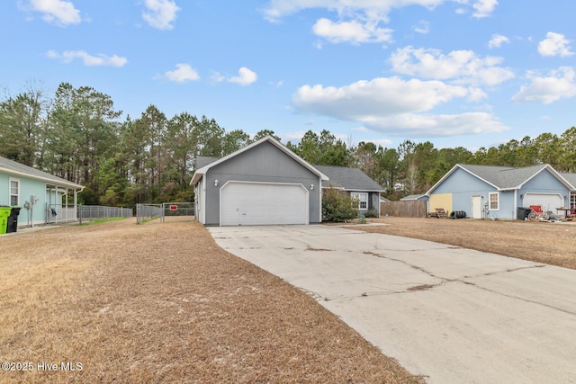 view of front of property with a garage and a front lawn