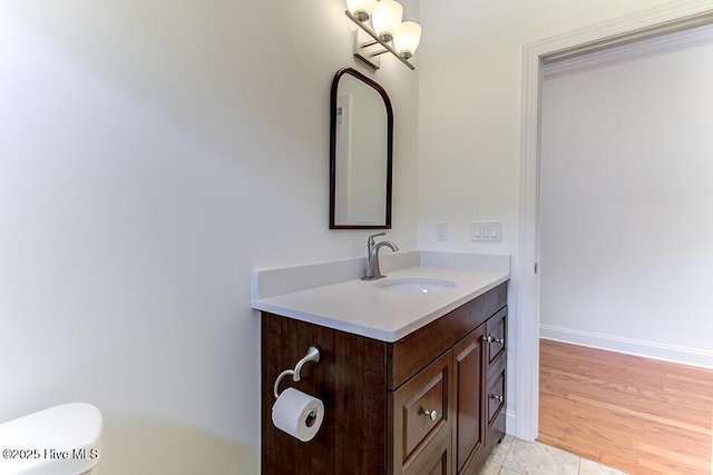 2173 Palm Pointe NE, Leland, NC 28451 - bathroom featuring vanity, toilet, and baseboards