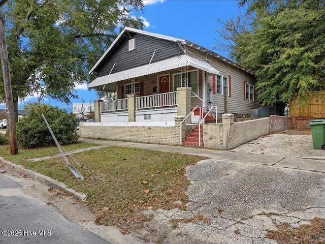 bungalow-style house featuring covered porch