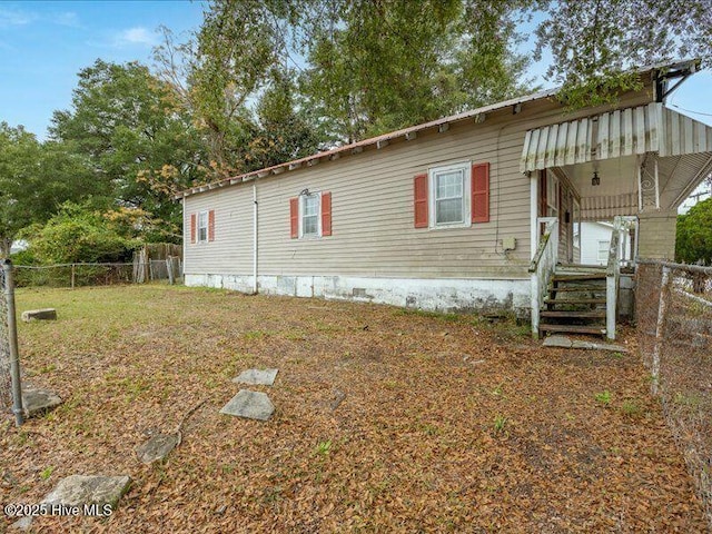 view of property exterior featuring a yard