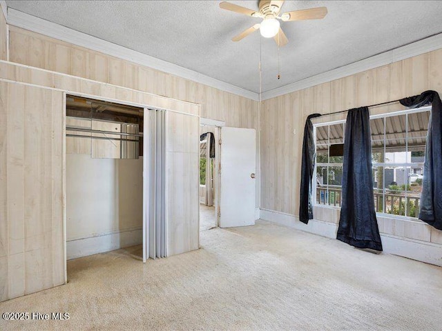 unfurnished bedroom featuring ornamental molding, a textured ceiling, and a closet