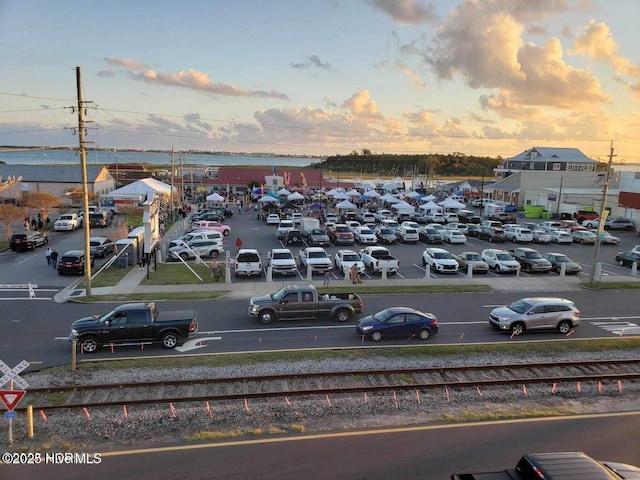 view of parking at dusk