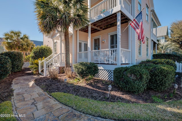 view of side of home featuring a balcony