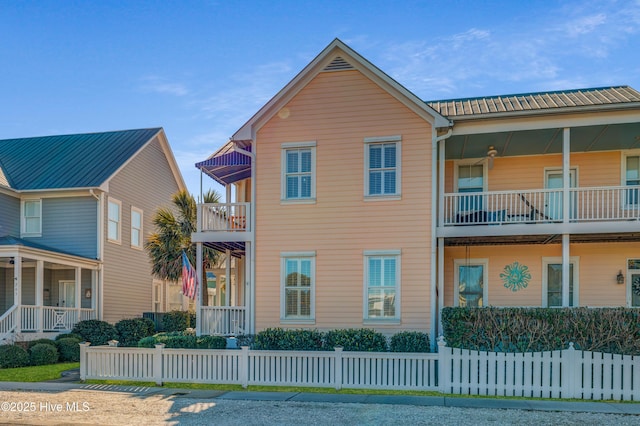 view of front of home featuring a balcony