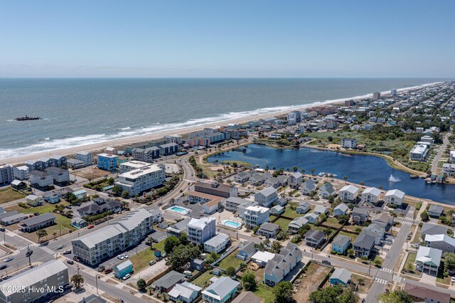 drone / aerial view with a water view and a view of the beach