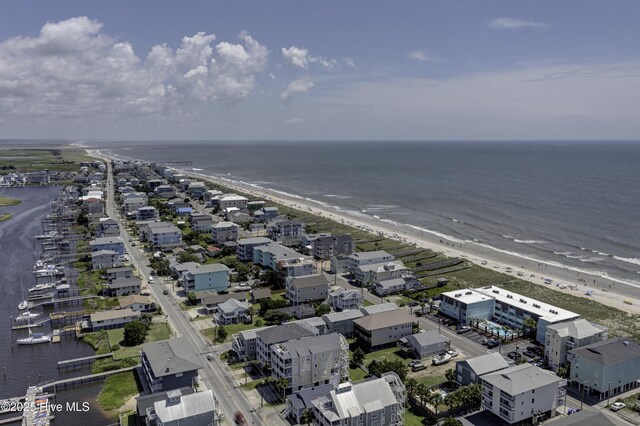 aerial view featuring a water view and a beach view