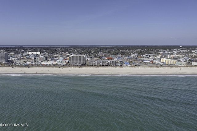 aerial view with a water view and a view of the beach