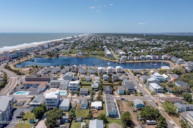 drone / aerial view with a water view and a view of the beach