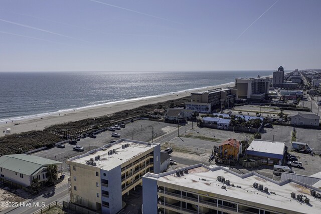 aerial view featuring a water view and a beach view