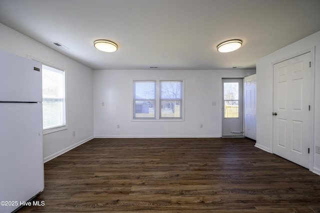 empty room featuring dark hardwood / wood-style floors