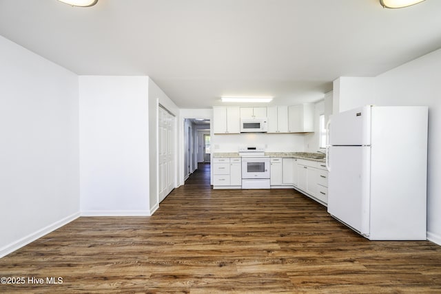 kitchen featuring white appliances, baseboards, light countertops, dark wood-type flooring, and white cabinetry