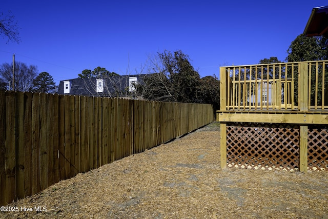 view of yard featuring a wooden deck