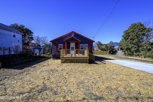 bungalow featuring a deck